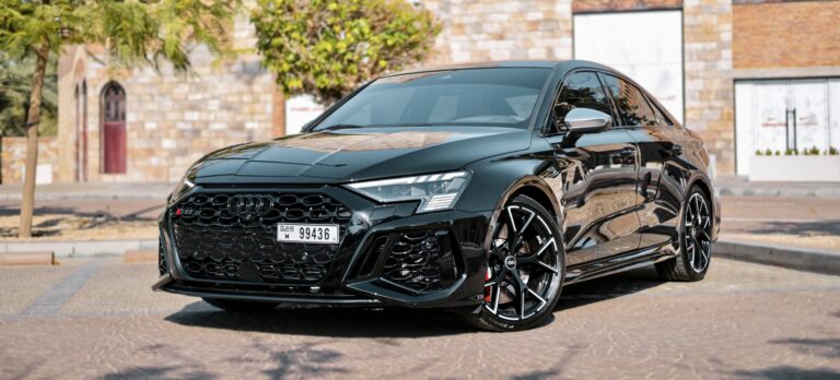 Powerful black Audi RS3 2023 for rent in Dubai offering sporty performance sleek design and advanced features for an exhilarating driving experience