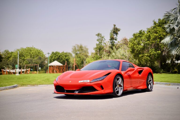 Iconic red Ferrari F8 Tributo Spider for rent in Dubai offering a thrilling open-top driving experience with exceptional performance luxurious design and advanced technology