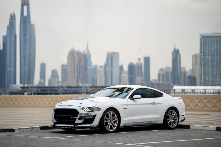 Stylish white Ford Mustang GT for rent in Dubai offering powerful performance sleek design and modern features for an exhilarating driving experience