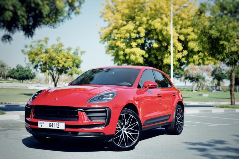 Sporty red Porsche Macan 2023 for rent in Dubai offering a perfect combination of luxury dynamic performance and advanced technology for an exceptional driving experience