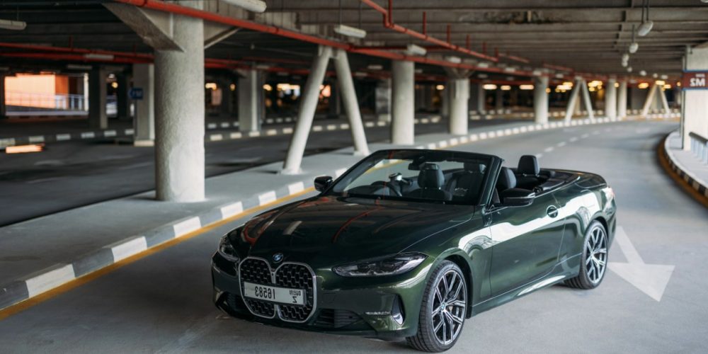 Stylish green BMW 430i Cabrio 2022 for rent in Dubai perfect for a unique and luxurious open-top driving experience