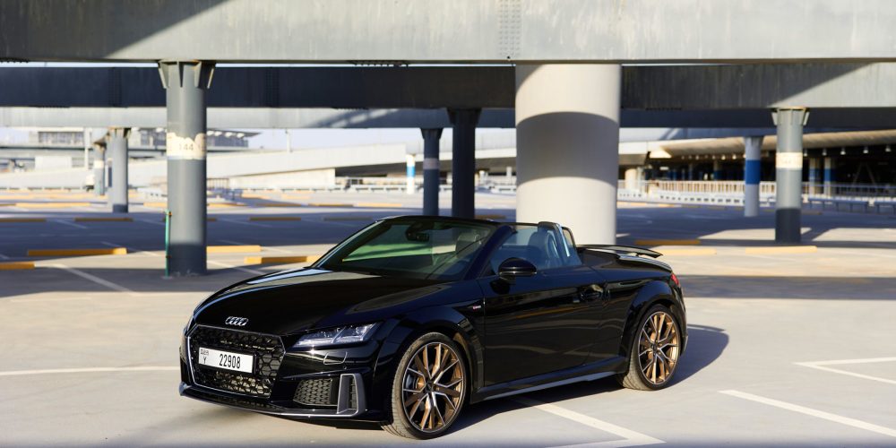 Sophisticated black Audi TT Roadster 2023 for rent in Dubai offering a luxurious and sporty open-top driving experience