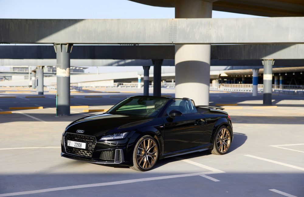 Sophisticated black Audi TT Roadster 2023 for rent in Dubai offering a luxurious and sporty open-top driving experience