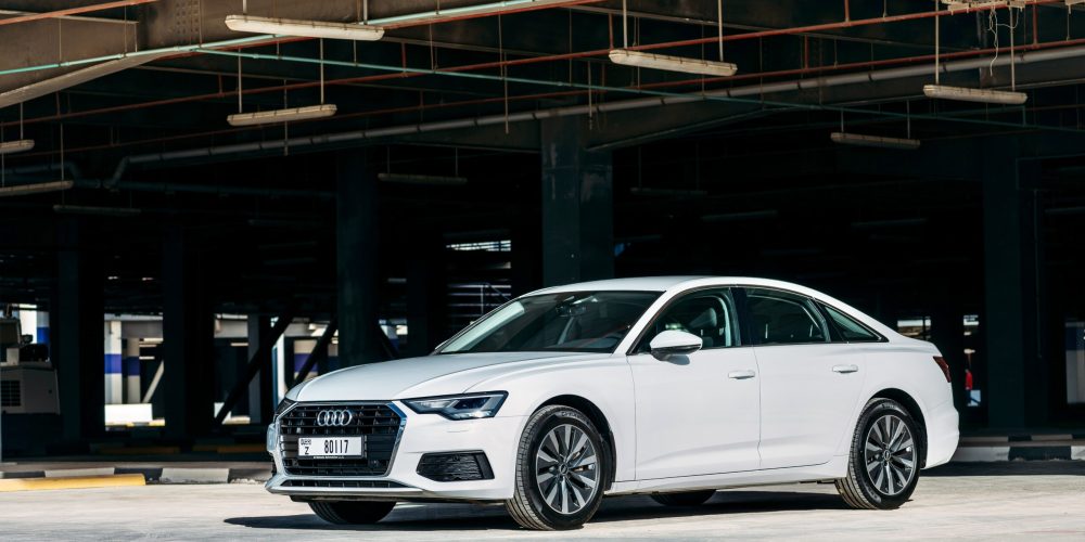 Elegant white Audi A6 2021 sedan for rent in Dubai, combining luxury, comfort, and advanced performance