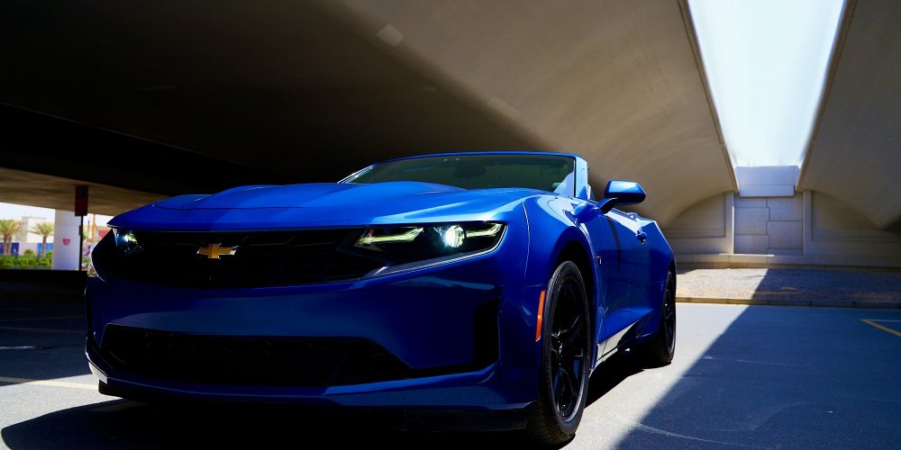 Stylish blue Chevrolet Camaro Cabriolet for rent in Dubai offering a thrilling open-top driving experience with sporty design powerful performance and modern features