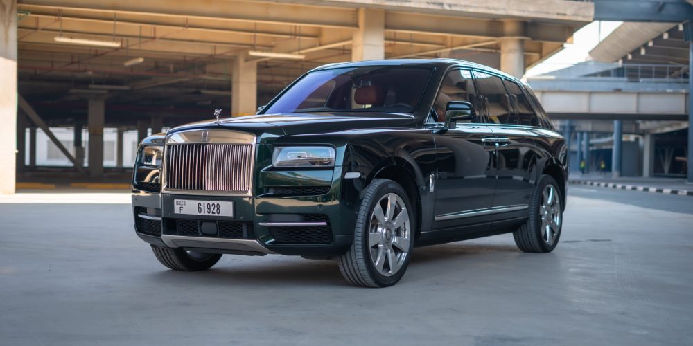 Exclusive green Rolls Royce Cullinan 2021 for rent in Dubai offering unparalleled luxury advanced features and powerful performance