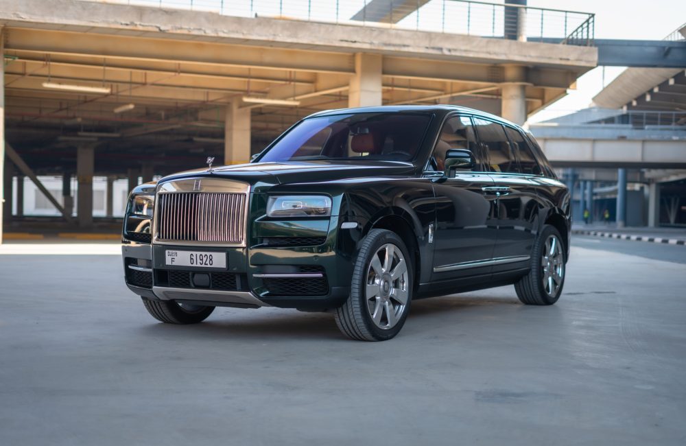 Exclusive green Rolls Royce Cullinan 2021 for rent in Dubai offering unparalleled luxury advanced features and powerful performance