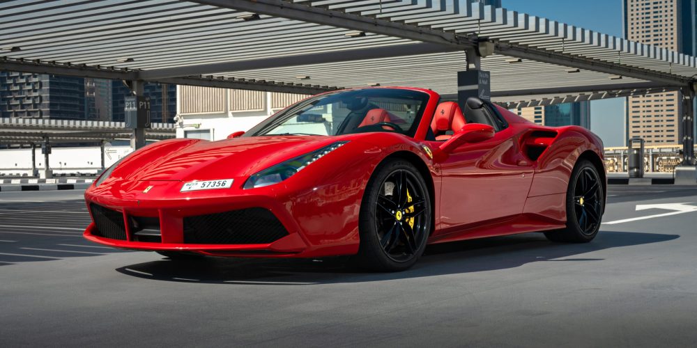 Rent a red Ferrari 488 Spyder in Dubai for an unforgettable experience. This luxurious convertible, featuring a powerful engine and sleek design, is perfect for those who want to make a statement and enjoy the thrill of driving through the streets of Dubai.