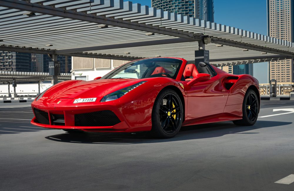 Rent a red Ferrari 488 Spyder in Dubai for an unforgettable experience. This luxurious convertible, featuring a powerful engine and sleek design, is perfect for those who want to make a statement and enjoy the thrill of driving through the streets of Dubai.