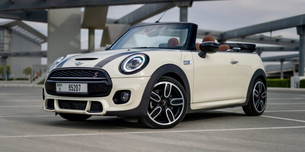 Stylish white Mini Cooper S Cabrio 2020 for rent in Dubai offering a fun open-top driving experience with sporty performance and modern comfort