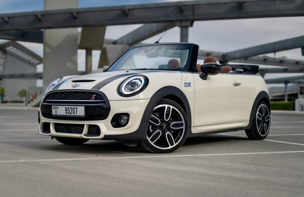 Stylish white Mini Cooper S Cabrio 2020 for rent in Dubai offering a fun open-top driving experience with sporty performance and modern comfort