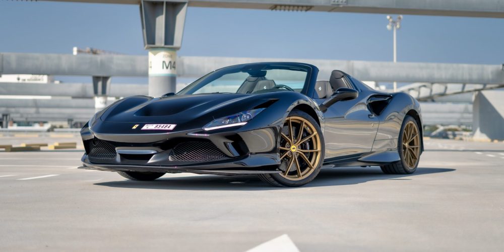 Luxurious black Ferrari F8 Tributo Spider 2023 for rent in Dubai offering an exhilarating open-top driving experience with unmatched performance and style