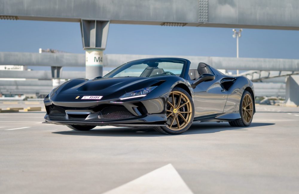 Luxurious black Ferrari F8 Tributo Spider 2023 for rent in Dubai offering an exhilarating open-top driving experience with unmatched performance and style