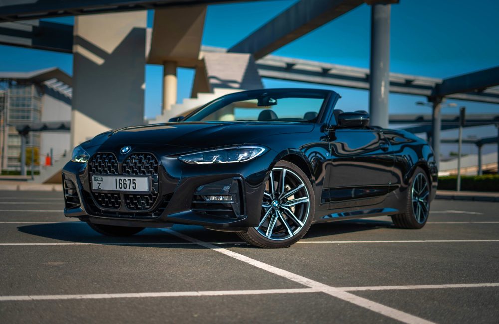 Stylish black BMW 430i Cabrio 2023 for rent in Dubai perfect for a luxurious and sporty open-top experience