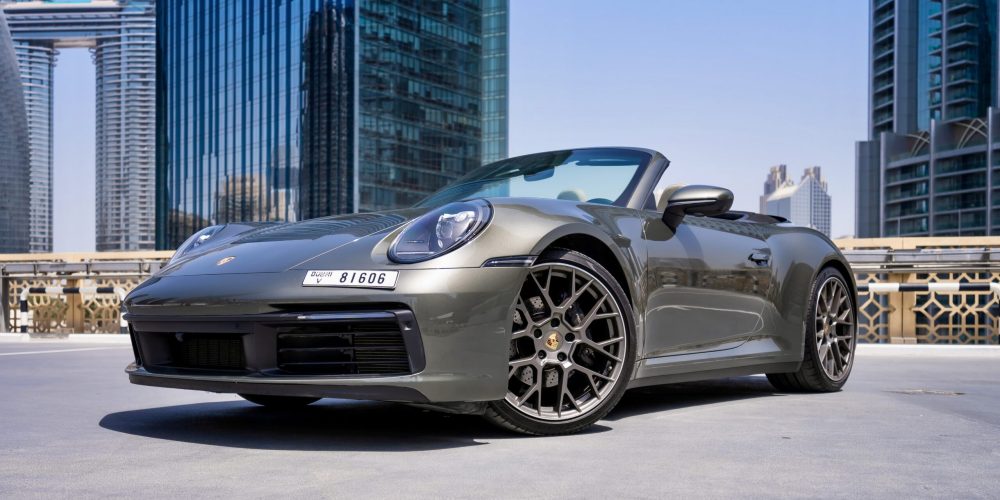 Stylish grey Porsche 911 Carrera Cabrio 2021 for rent in Dubai offering a luxurious open-top driving experience with exceptional performance and iconic design