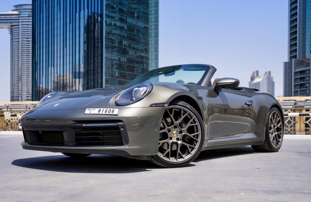 Stylish grey Porsche 911 Carrera Cabrio 2021 for rent in Dubai offering a luxurious open-top driving experience with exceptional performance and iconic design