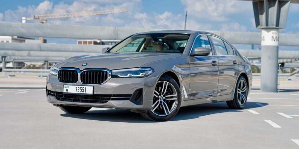 Sophisticated grey BMW 520i 2021 for rent in Dubai offering luxury comfort and exceptional performance