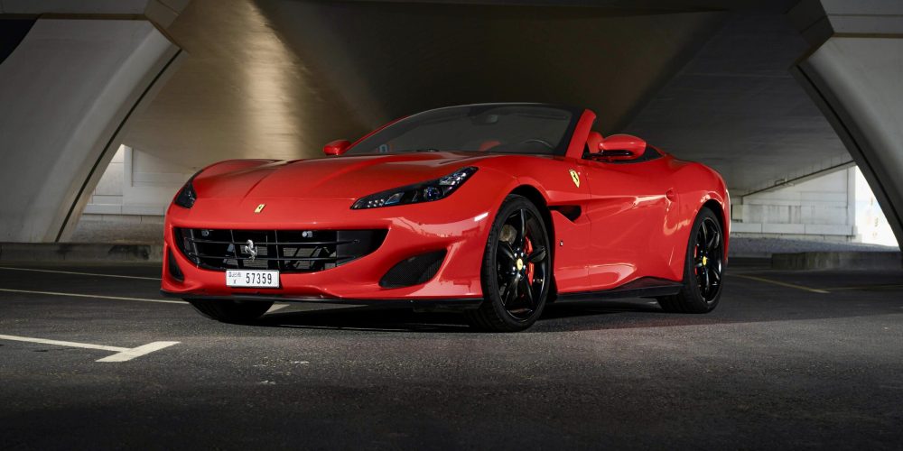 Exquisite red Ferrari Portofino 2019 with a rosso red roof for rent in Dubai offering unmatched luxury style and thrilling performance