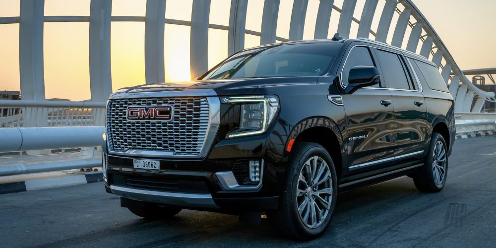 Premium black GMC Denali XL 2021 top-of-the-line edition for rent in Dubai offering spacious luxury advanced features and powerful performance