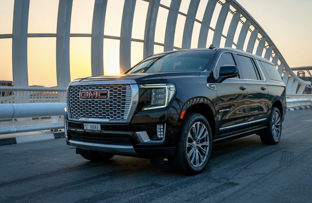 Premium black GMC Denali XL 2021 top-of-the-line edition for rent in Dubai offering spacious luxury advanced features and powerful performance