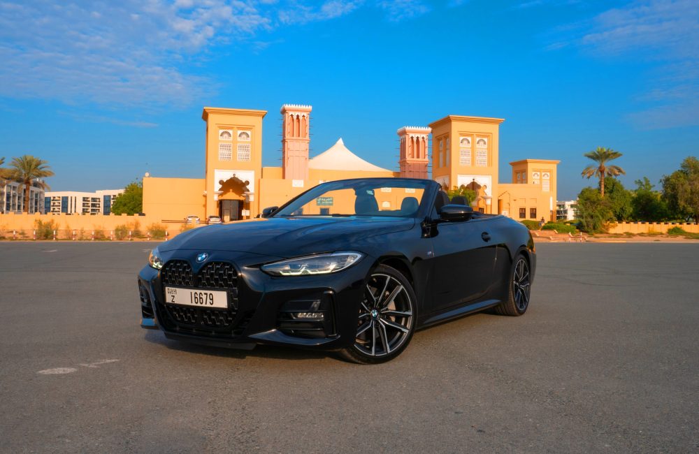 Elegant black BMW 430i Cabrio 2023 for rent in Dubai offering a premium and dynamic convertible driving experience