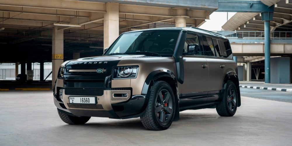 Rugged brown Range Rover Defender V6 X 2021 for rent in Dubai combining off-road capability advanced technology and luxurious comfort