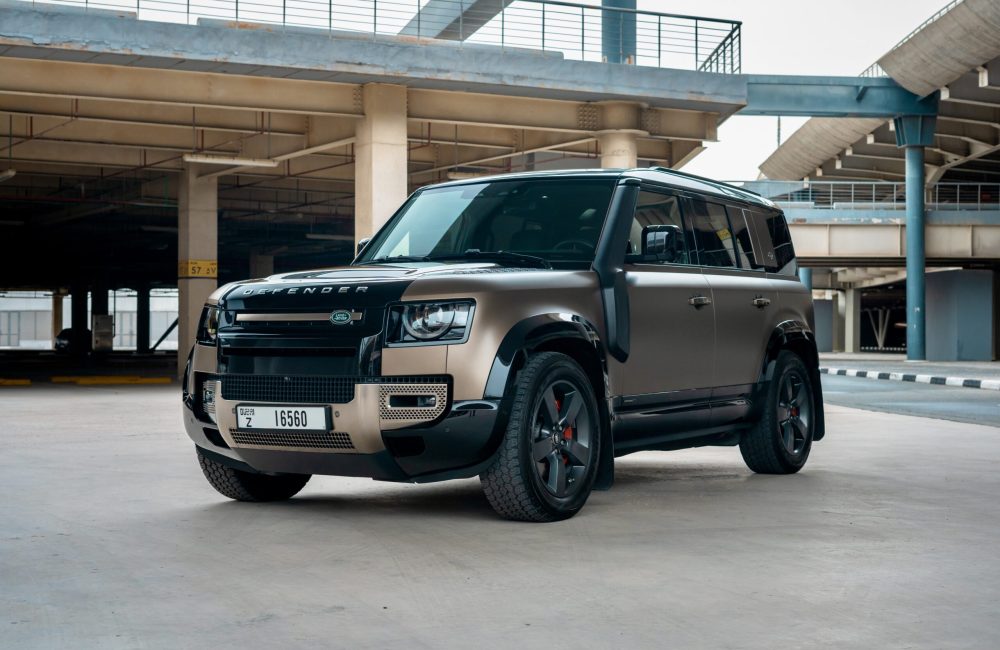 Rugged brown Range Rover Defender V6 X 2021 for rent in Dubai combining off-road capability advanced technology and luxurious comfort