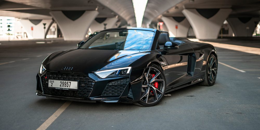 Stunning black Audi R8 V10 Spyder 2021 convertible for rent in Dubai, delivering exceptional performance and a luxurious open-top experience