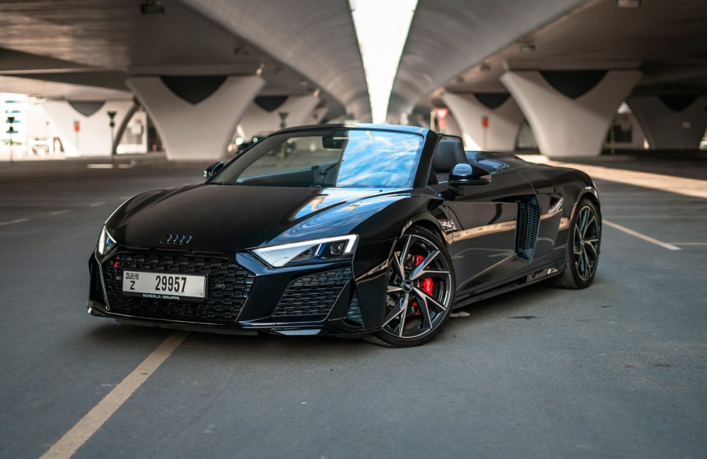 Stunning black Audi R8 V10 Spyder 2021 convertible for rent in Dubai, delivering exceptional performance and a luxurious open-top experience