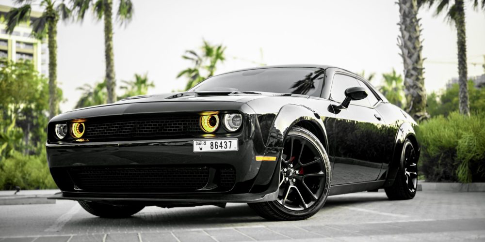 Powerful black Dodge Challenger for rent in Dubai offering a bold design thrilling performance and modern comfort