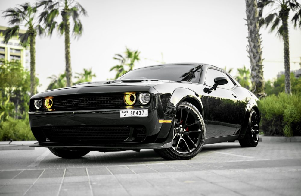 Powerful black Dodge Challenger for rent in Dubai offering a bold design thrilling performance and modern comfort