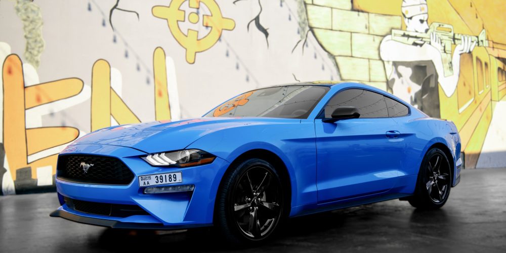 Stylish blue Ford Mustang 2023 for rent in Dubai offering a perfect combination of sporty performance modern features and iconic design