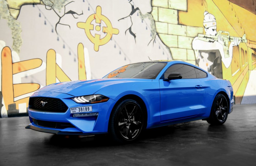 Stylish blue Ford Mustang 2023 for rent in Dubai offering a perfect combination of sporty performance modern features and iconic design