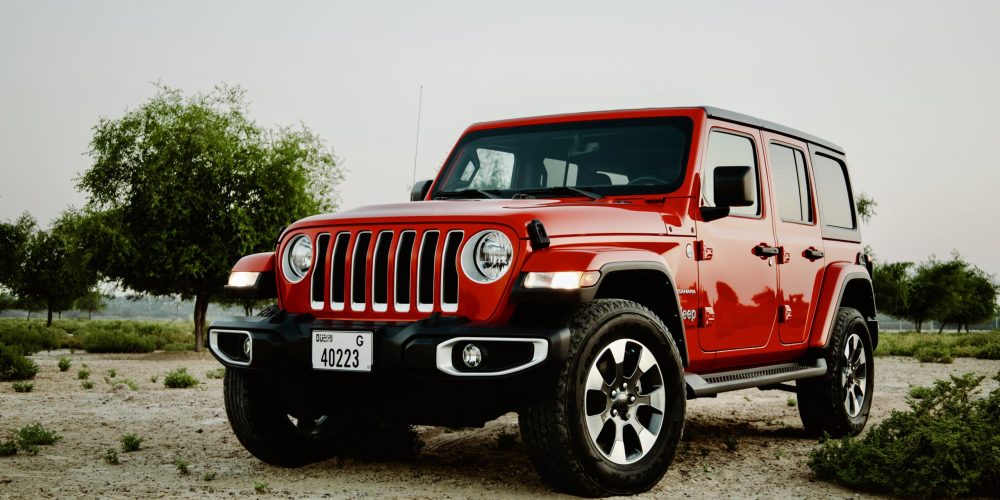 Bold red Jeep Wrangler V6 2022 for rent in Dubai offering powerful performance rugged design and exceptional off-road capability