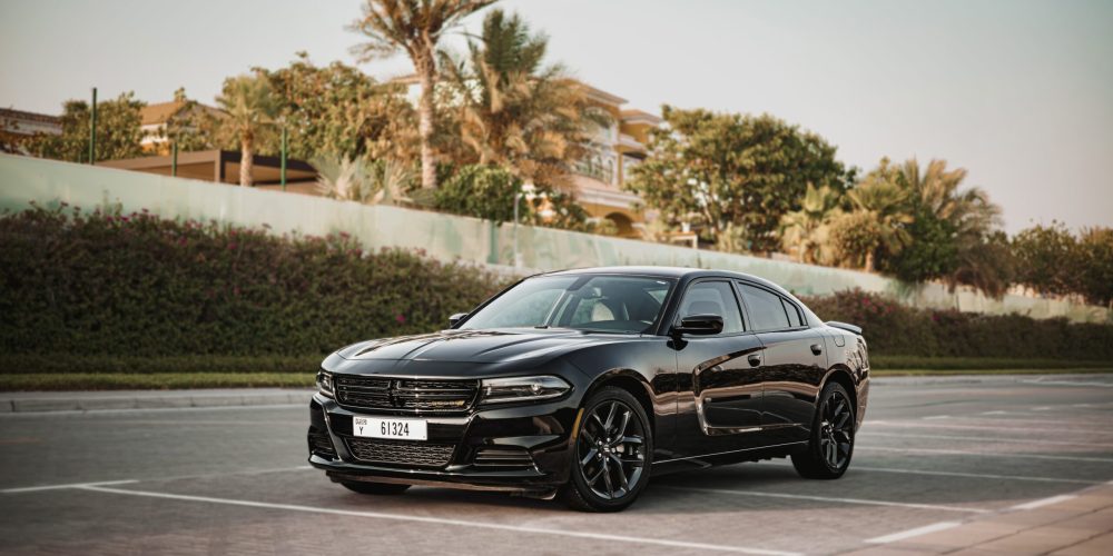 Powerful black Dodge Charger for rent in Dubai offering a bold design high-performance engineering and modern features for an exhilarating driving experience