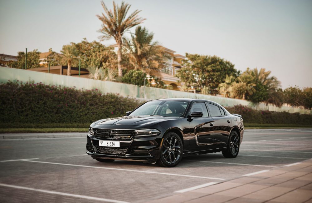 Powerful black Dodge Charger for rent in Dubai offering a bold design high-performance engineering and modern features for an exhilarating driving experience