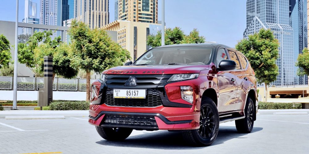 Rugged red Mitsubishi Montero 2023 for rent in Dubai offering powerful performance spacious comfort and advanced features for a reliable and versatile driving experience