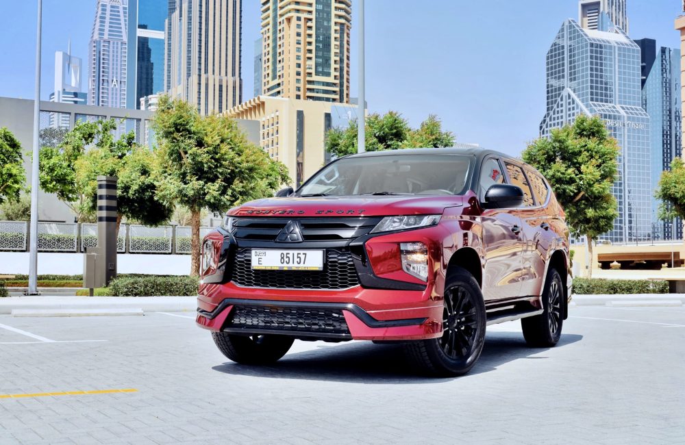 Rugged red Mitsubishi Montero 2023 for rent in Dubai offering powerful performance spacious comfort and advanced features for a reliable and versatile driving experience