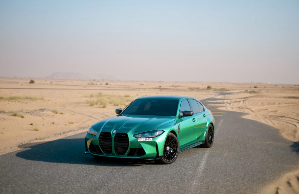 Bold green BMW M3 2023 for rent in Dubai offering high-performance engineering sleek design and luxurious comfort for an exhilarating driving experience