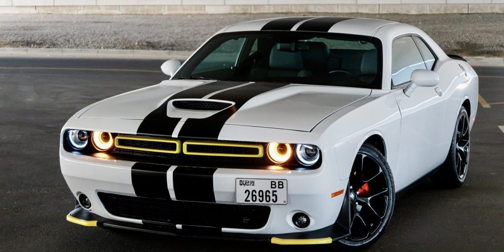 Striking white and black Dodge Challenger 2023 for rent in Dubai offering a blend of bold design powerful performance and modern comfort