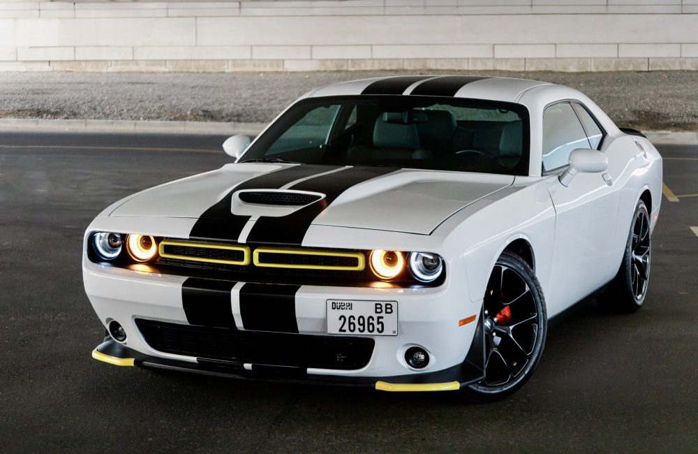 Striking white and black Dodge Challenger 2023 for rent in Dubai offering a blend of bold design powerful performance and modern comfort