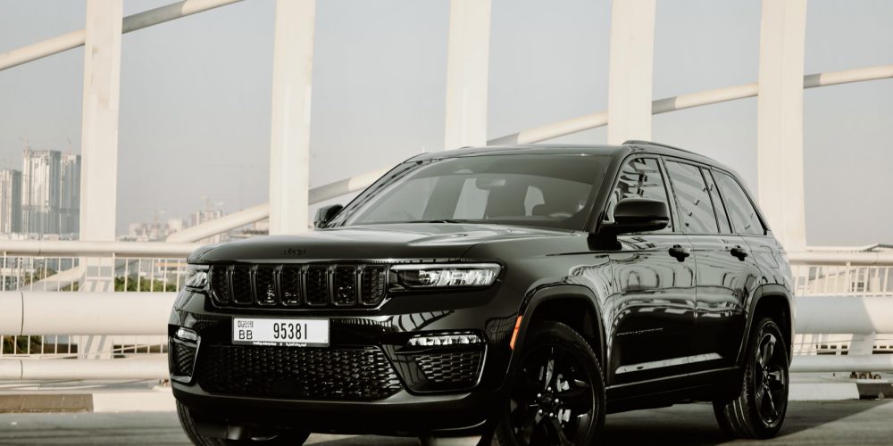 Rugged black Jeep Grand Cherokee 2023 for rent in Dubai offering a blend of luxury advanced features and exceptional off-road capability