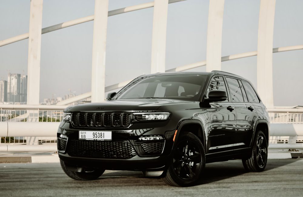 Rugged black Jeep Grand Cherokee 2023 for rent in Dubai offering a blend of luxury advanced features and exceptional off-road capability