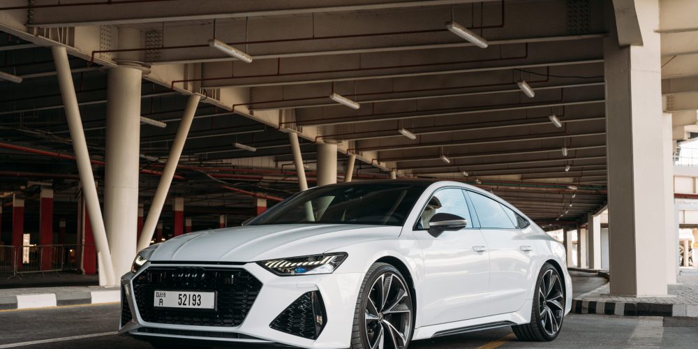 Luxurious white Audi RS7 2023 sports car for rent in Dubai, combining high performance and elegant design