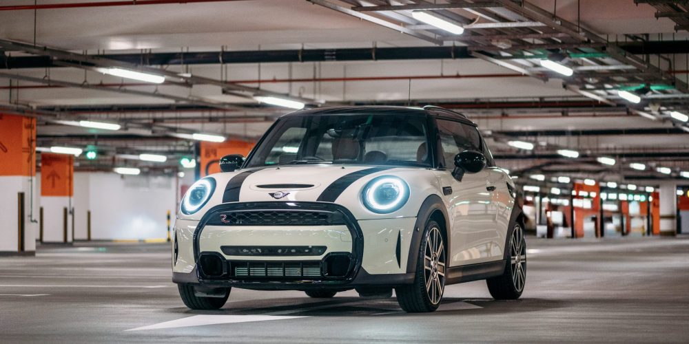 Sleek white Mini Cooper S 2-door 2023 for rent in Dubai offering a compact stylish design with sporty performance and premium comfort