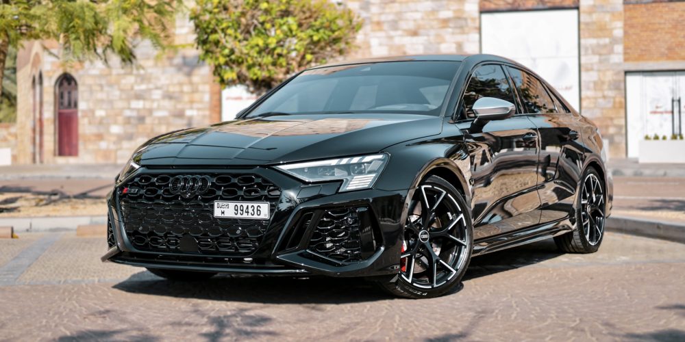 Powerful black Audi RS3 2023 for rent in Dubai offering sporty performance sleek design and advanced features for an exhilarating driving experience