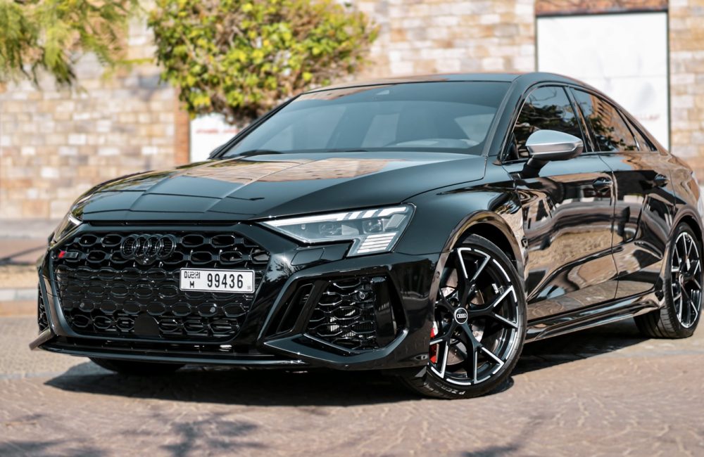 Powerful black Audi RS3 2023 for rent in Dubai offering sporty performance sleek design and advanced features for an exhilarating driving experience