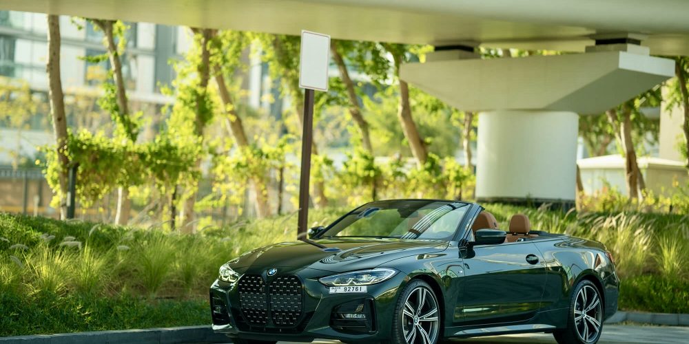 Elegant green BMW 420 Convertible 2023 for rent in Dubai offering a luxurious open-top driving experience with advanced technology and sporty performance