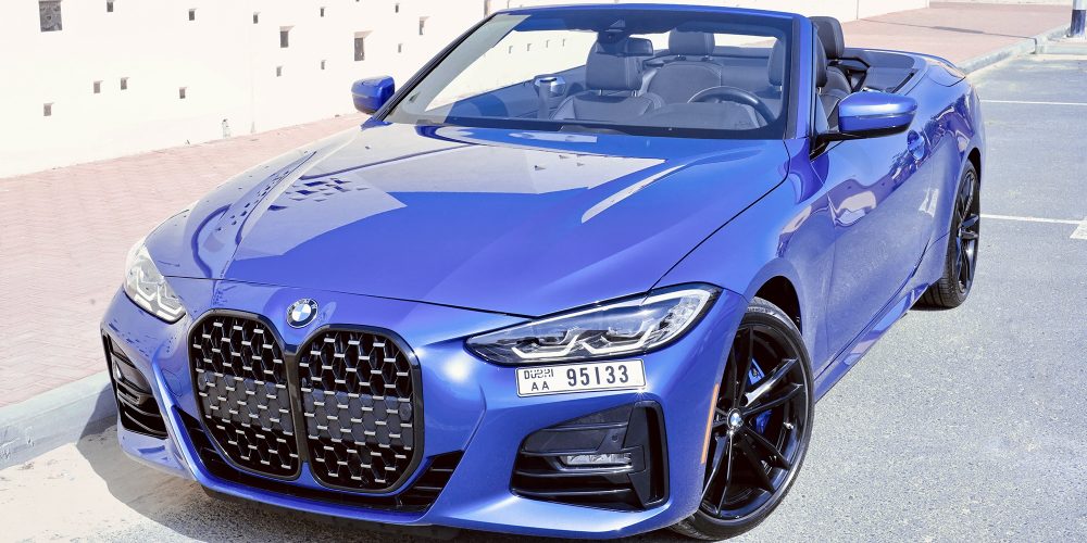 Stylish blue BMW 430 Convertible 2023 for rent in Dubai offering a premium open-top driving experience with advanced features and dynamic performance