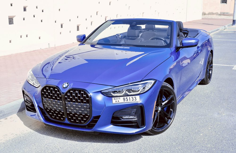 Stylish blue BMW 430 Convertible 2023 for rent in Dubai offering a premium open-top driving experience with advanced features and dynamic performance